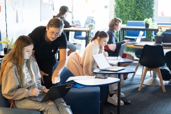 students and teacher in a Y Schools classroom